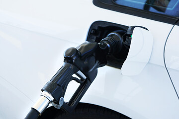 Fuel being pumped into car with vapor recovery system.