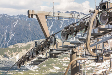 Fototapeta premium A fragment of the mountain chairlift in the area of Kasprowy Wierch, closed in the summer.