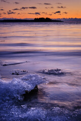 sunset over the frozen lake