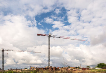 Construction begins, construction cranes are visible above the fence surrounding the site