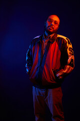 Neon Light hispanic Portrait in trendy jacket and sunglasses
