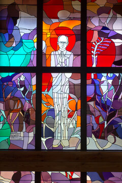 Zakopane, Poland, June 8, 2021: Interior of the Holy Cross Church in Zakopane. Stained glass window dedicated to to Saint Maksymilian Kolbe