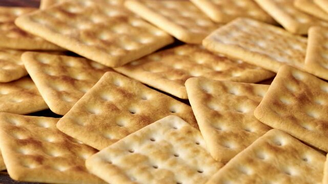 Background of stacked salty cracker cookies, close up