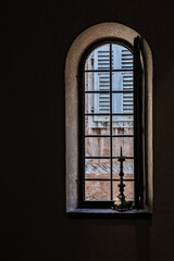 Window in an old church with a candlestick