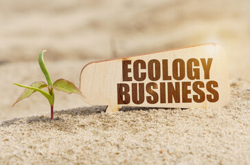 Near the sprout there is a plate with the inscription - ECOLOGY BUSINESS