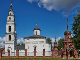 Obraz premium Russia. The town of Volokolamsk. Kremlin. View from the South. The bell tower and the Resurrection Cathedral behind the Kremlin fence. Corner Tower with Cathedral Chapel