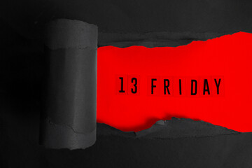 Friday 13 on dark red background. Top view