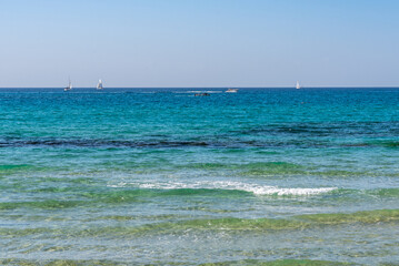 Fototapeta na wymiar Sailboats on the Mediterranean Sea of the shore of Tel Aviv, Israel 