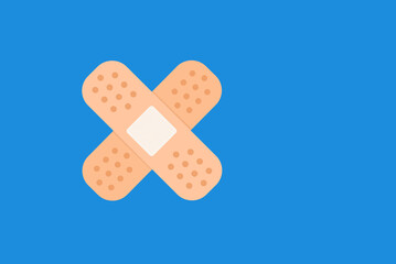 Sticking plaster icon, crossed adhesive bandage or band aid - flat design illustration against blue background with copy space
