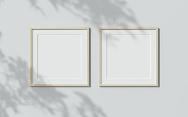 Two wooden frames on white wall. 3D render wooden frame mock up. Empty interior. 3D illustrations. 3D design interior. Template for business. Passe partout frame. Shadow on the wall.	
