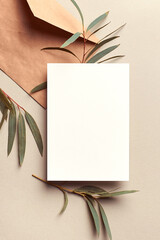 Greeting card or invitation mockup with envelope and green eucalyptus twigs