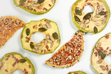 healthy snack. healthy fruits with seeds and nuts. Apple and orange chips