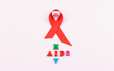 Red ribbon. Cancer control symbol.