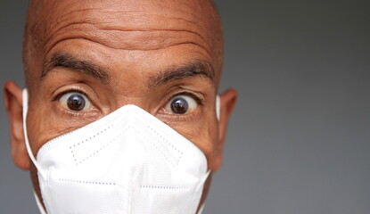 man with dust mask fighting the Coronavirus  pandemic outbreak on grey background