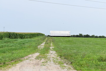 Gravel Road Leading to a Barn