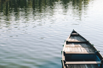 Reflection in the water of boats over nature background