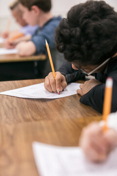 Classroom: Boy Working Hard On Classwork