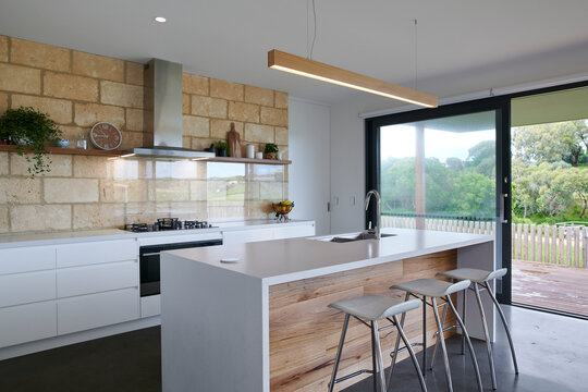 Modern kitchen interior with glass splashback

