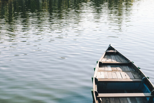 Reflection in the water of boats over nature background