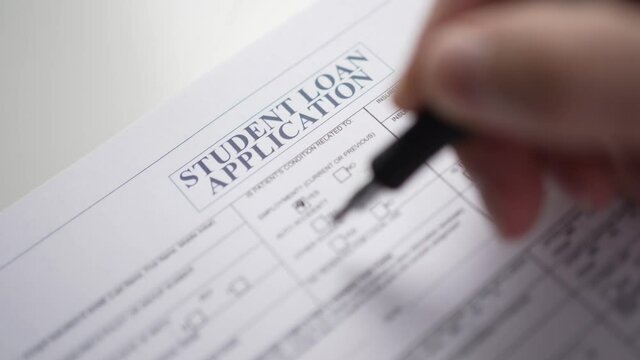 Filling a Student Loan Application Form on a Paper