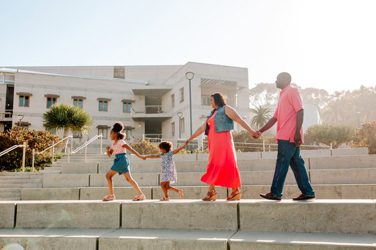 Happy Black family in empty amphitheater 