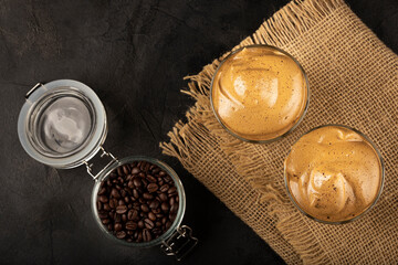 Iced Dalgona Coffee, glass with milk and coffee cream.