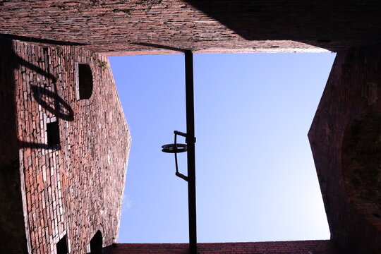 Abandoned industrial building with pulley system against bright sunny sky - Dudley, West Midlands, England