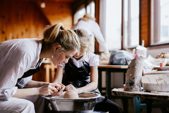 Master class of handicraft in spacious workshop 