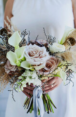 bride holding bouquet of flowers