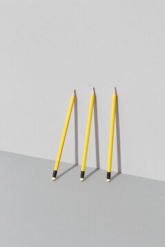 Three bright yellow pencils