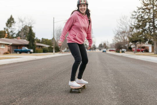 Happy, Smiling Woman on Skateboard