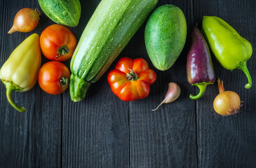 A set of fresh vegetables for a salad diet on a vintage table. Cooking salad in the restaurant kitchen. Free ad space