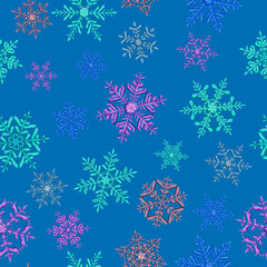 Seamless pattern of complex Christmas snowflakes in various colors on light blue background