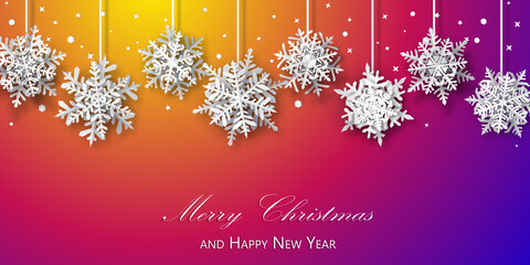 Christmas background of paper snowflakes with soft shadows, white on purple and orange background