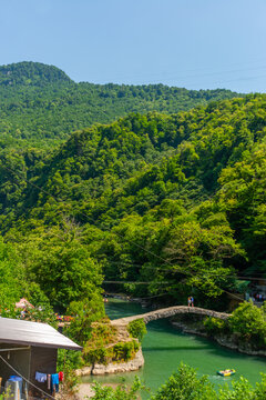 BATUMI, GEORGIA: Stone arch bridge of Queen Tamara near the Adjaristskali River on a sunny summer day.