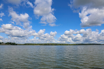 Beautiful natural summer landscape with picturesque lake Senezh and cloudy sky. Moscow region, Russia