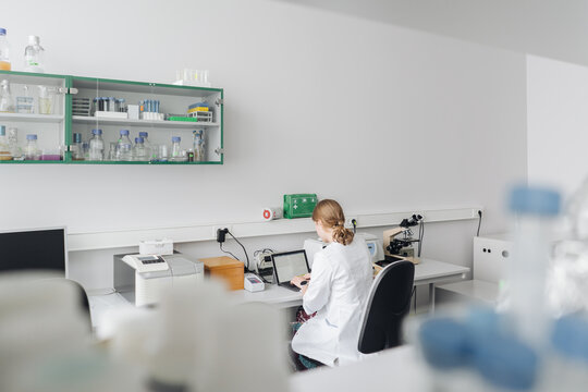 Scientist Using Laptop In The Lab