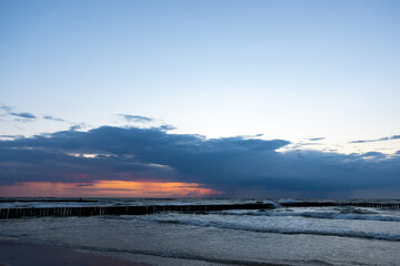 Sunset over the sea beach. Photo taken in low light conditions.