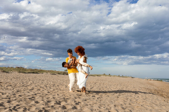 Beatiful black family having fun at the beach