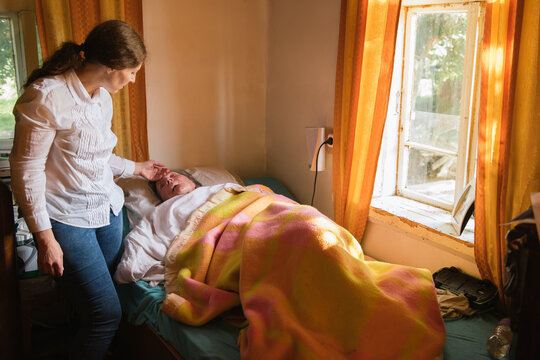 Old Woman With Disability Attended With Love
