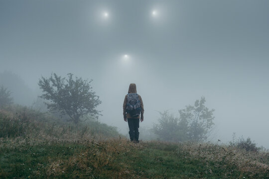 Man looking at strange lights in the sky