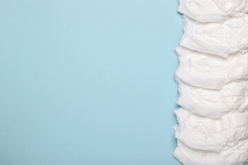 Background with baby diapers. Flat layout, top view, a place to copy.