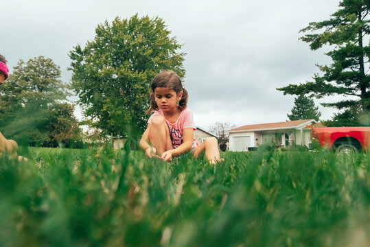 Young girl busy playing quietly. 