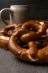 oktoberfest food with pretzels and beer background