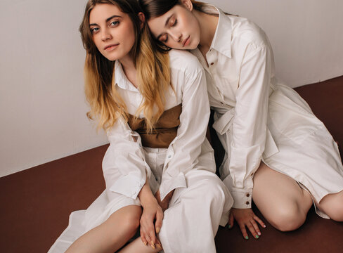 Fashion portrait of two dressy models 