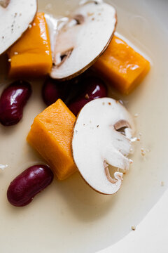 Food: Consome of Ceps, pumpkin gnochi and black beans