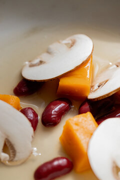 Food: Consome of Ceps, pumpkin gnochi and black beans