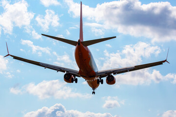 Passenger aircraft landing approach to the airport. Airplane flight in the sky.