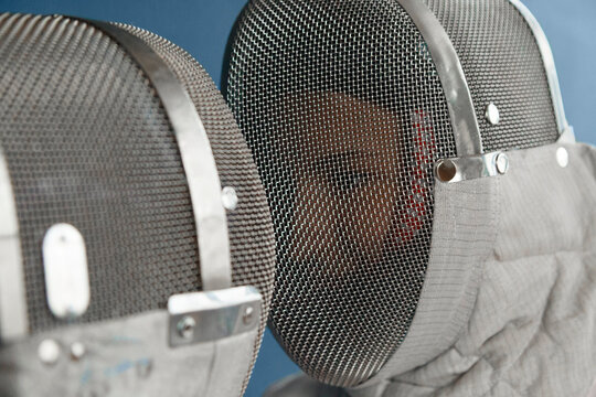 Anonymous fencer looking at opponent