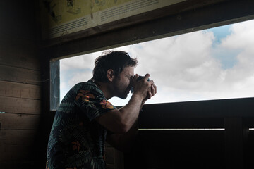 Photographer takes photos in a bird observatory